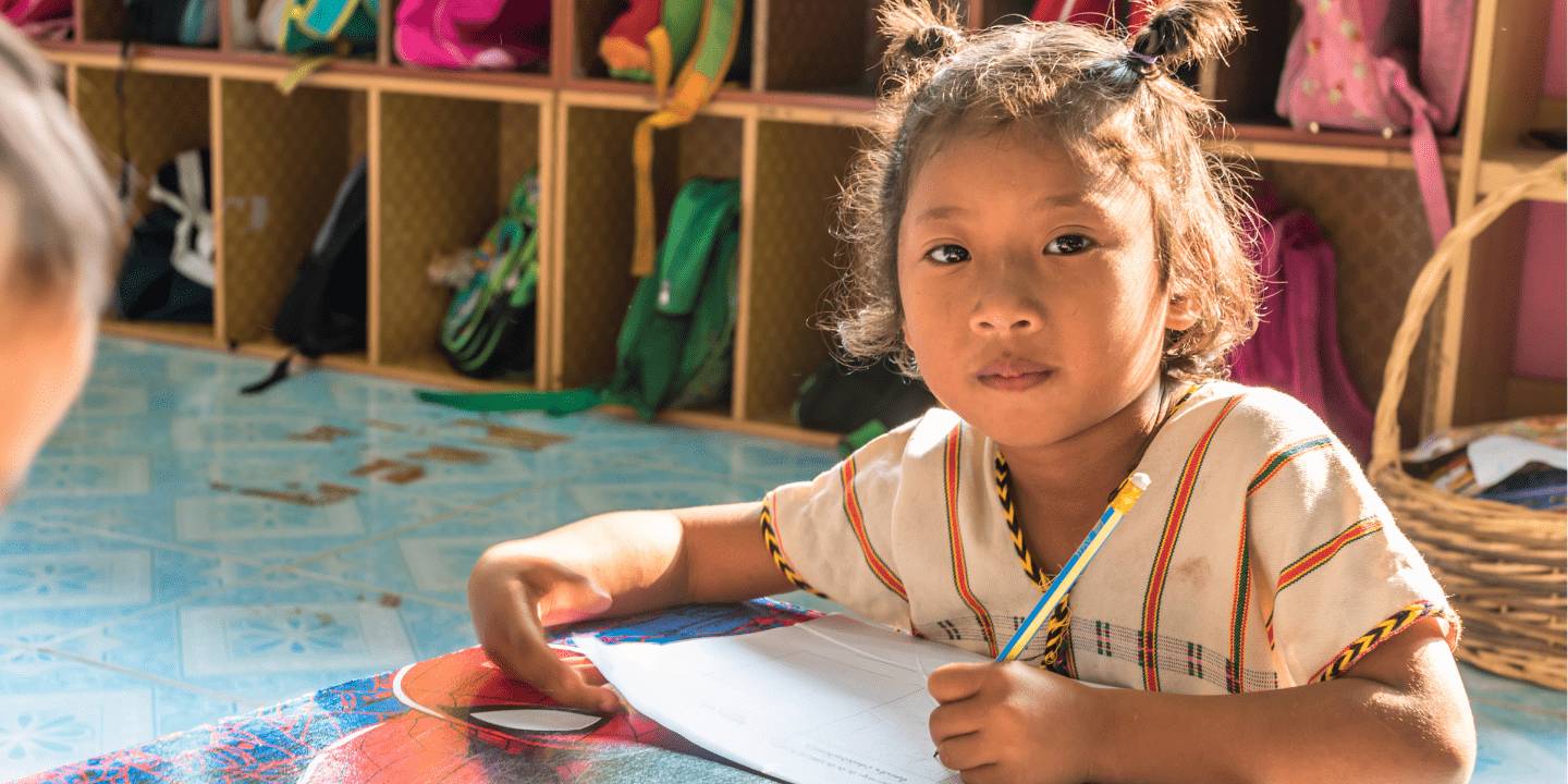 Young Karen girl learns at school on border of Thailand and Myanmar.